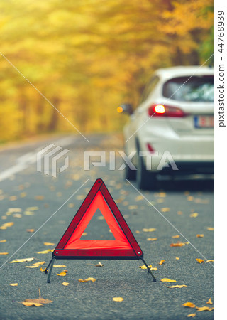 Broken car concept, breakdown triangle on road Broken car concept, breakdown triangle on road 44768939