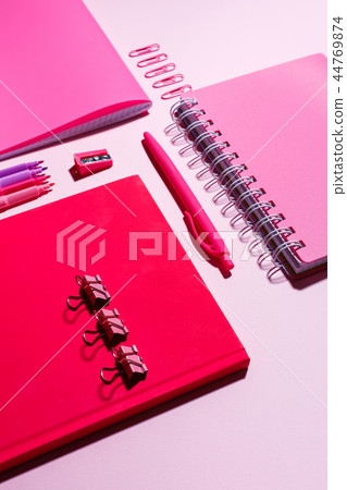 Pink notebooks on a pink background flat lay Pink notebooks on a pink background flat lay 44769874