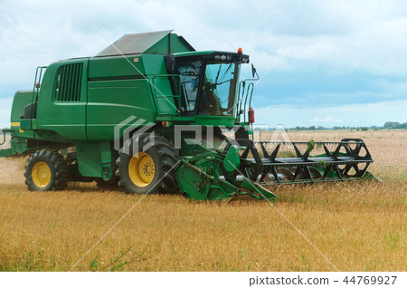 the tractor is working in the field 44769927