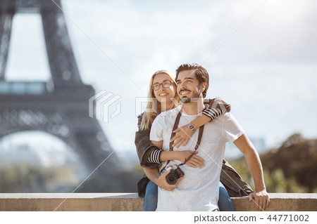 Paris Eiffel tower romantic couple embracing kissing in front of Eiffel Tower, Paris, France. Paris Eiffel tower romantic couple embracing kissing in front of Eiffel Tower, Paris, France. 44771002