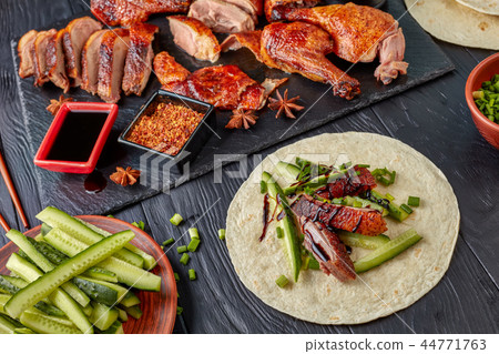 close-up of Juicy Peking Duck on slate tray 44771763