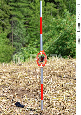Practical use outdoor of mini-prisms on the mini-milestone for total station Practical use outdoor of mini-prisms on the mini-milestone for total station 44772421
