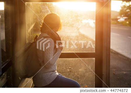 Girl on a bus stop Girl on a bus stop 44774872