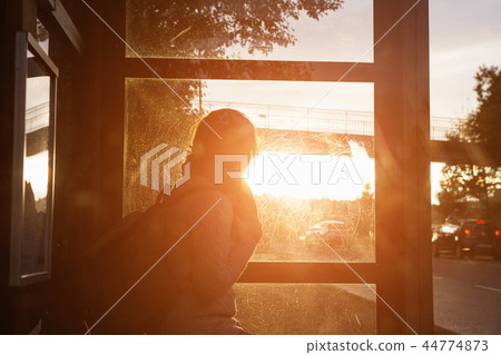 Girl on a bus stop Girl on a bus stop 44774873