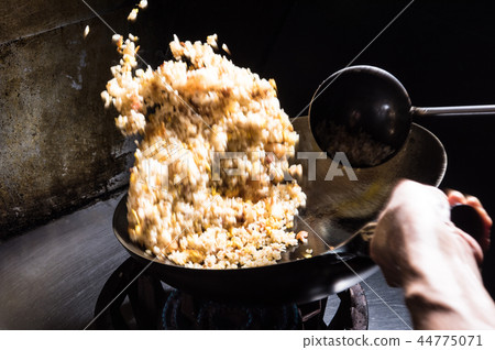 Cooked rice during cooking 44775071