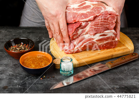 Close up of Male hands chopping knife pork 44775821