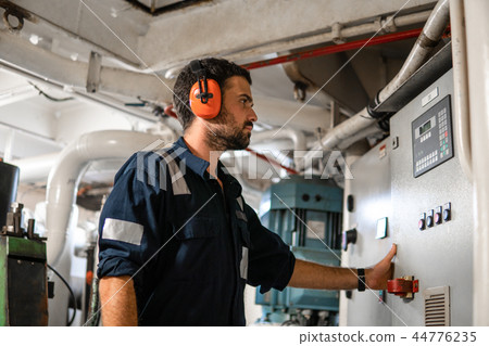 Marine engineer officer working in engine room 44776235
