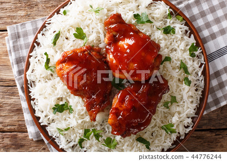 Delicious glazed chicken with spicy sauce and rice Delicious glazed chicken with spicy sauce and rice 44776244