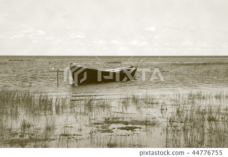 Wooden boat near the lake bank 44776755