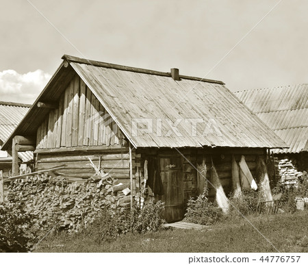 Old wooden shack with stack of firewood Old wooden shack with stack of firewood 44776757