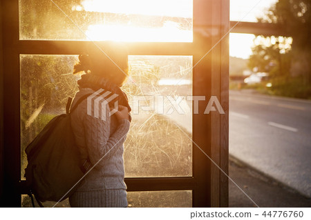 Girl on a bus stop Girl on a bus stop 44776760