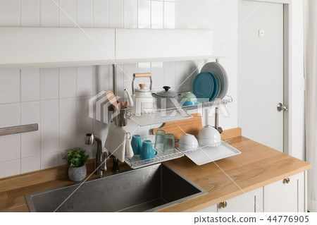 Image of dishwasher with kitchen utensils, kitchen with white background Image of dishwasher with kitchen utensils, kitchen with white background 44776905
