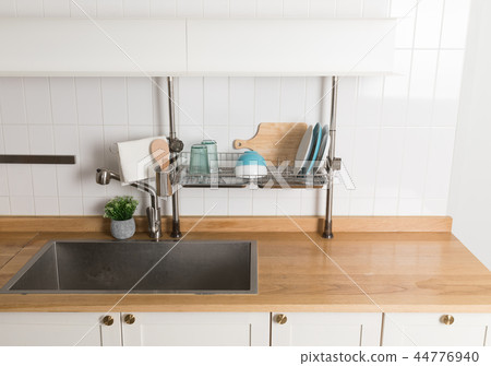 Image of dishwasher with kitchen utensils, kitchen with white background Image of dishwasher with kitchen utensils, kitchen with white background 44776940