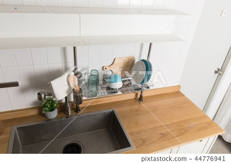 Image of dishwasher with kitchen utensils, kitchen with white background Image of dishwasher with kitchen utensils, kitchen with white background 44776941