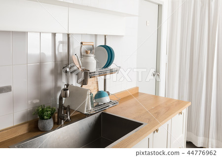 Image of dishwasher with kitchen utensils, kitchen with white background Image of dishwasher with kitchen utensils, kitchen with white background 44776962