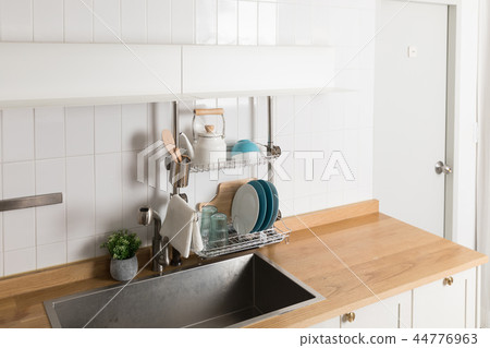 Image of dishwasher with kitchen utensils, kitchen with white background Image of dishwasher with kitchen utensils, kitchen with white background 44776963