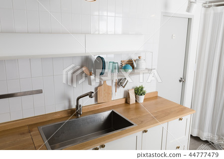Image of dishwasher with kitchen utensils, kitchen with white background Image of dishwasher with kitchen utensils, kitchen with white background 44777479