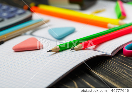 Bright items for a school on a wooden table Bright items for a school on a wooden table 44777646