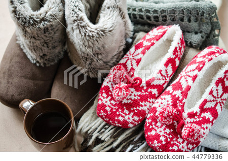 Woolen plaid and home slippers and hot drink. 44779336