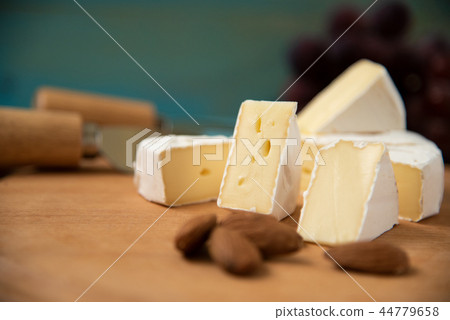 cheese camembert with raspberries and nuts, melange 44779658