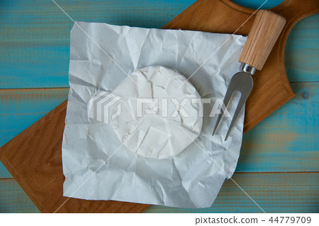 cheese brie or camembert, with a fork 44779709