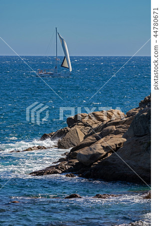 Nice sailboat on the Spanish ocean in Costa Brava Nice sailboat on the Spanish ocean in Costa Brava 44780671