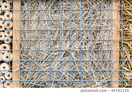 Close-up part of craft hotel or house for wild bees and other insect made of natural eco materials Close-up part of craft hotel or house for wild bees and other insect made of natural eco materials 44781158
