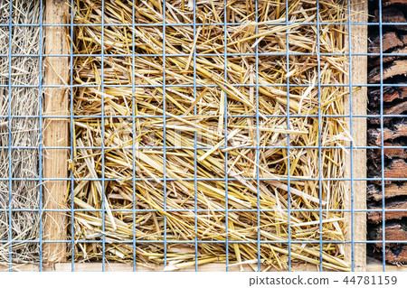 Close-up part of craft hotel or house for wild bees and other insect made of natural eco materials Close-up part of craft hotel or house for wild bees and other insect made of natural eco materials 44781159