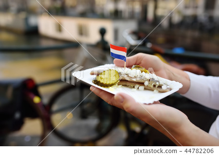 Famous herring fish with onion in Amsterdam Famous herring fish with onion in Amsterdam 44782206
