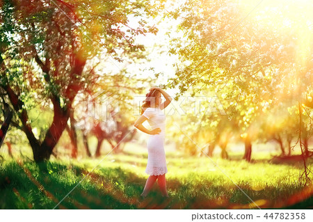 spring girl apple flowers, nature portrait of happy girl with long hair in blooming apple trees, freedom purity concept of happiness spring girl apple flowers, nature portrait of happy girl with long hair in blooming apple trees, freedom purity concept of happiness 44782358
