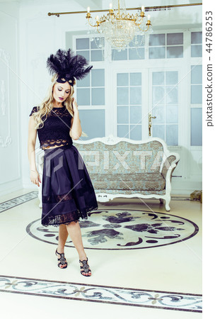 pretty blond woman in rich luxury house interior, fashion people 44786253