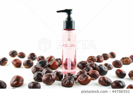 Cosmetic jar and chestnuts on white background Cosmetic jar and chestnuts on white background 44786501