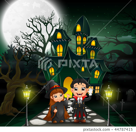 Happy halloween vampire and witch in front of the  44787415