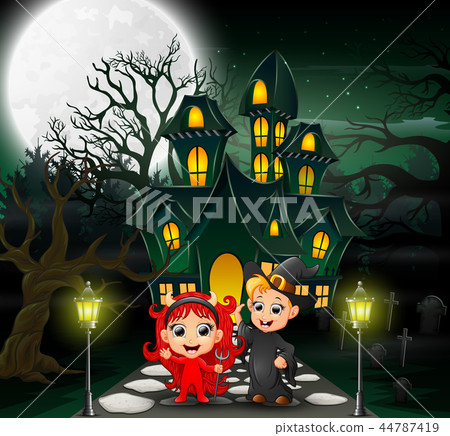Happy halloween kids in front of the haunted house Happy halloween kids in front of the haunted house 44787419
