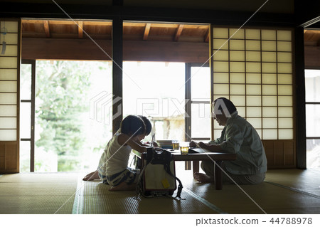 Boy doing homework on summer vacation 44788978