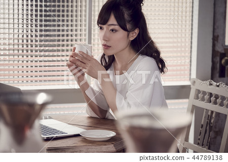 A woman at a cafe A woman at a cafe 44789138