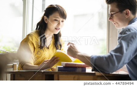 Woman studying English in a cafe 44789494