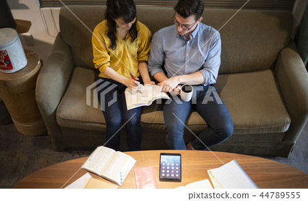 Woman studying English in a cafe 44789555