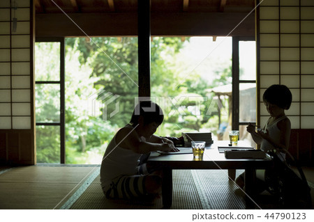 Boy doing homework on summer vacation Boy doing homework on summer vacation 44790123
