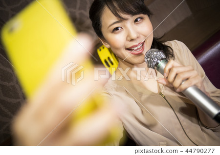 Women who enjoy karaoke alone 44790277