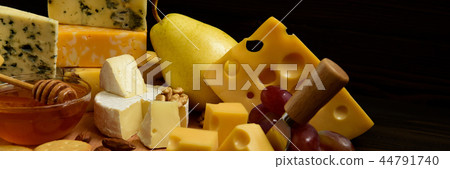 Different types of cheeses on a blackboard Different types of cheeses on a blackboard 44791740