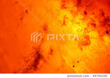 Close-up rock salt lamp that emits meditative light 44794200