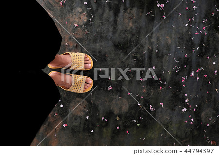 feet wear black pants, plastic sandals feet wear black pants, plastic sandals 44794397