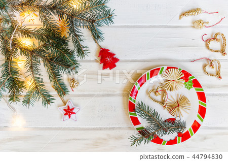 Christmas fir tree branches on white rustic wooden background with copy space for text 44794830