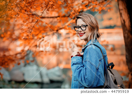 beautiful young girl in jacket in a park beautiful young girl in jacket in a park 44795919