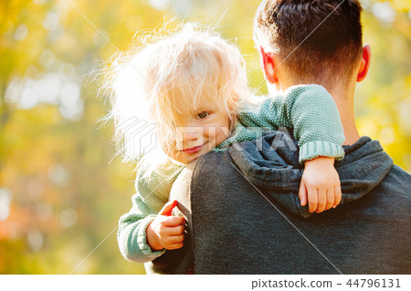 White little girl with father in a park White little girl with father in a park 44796131