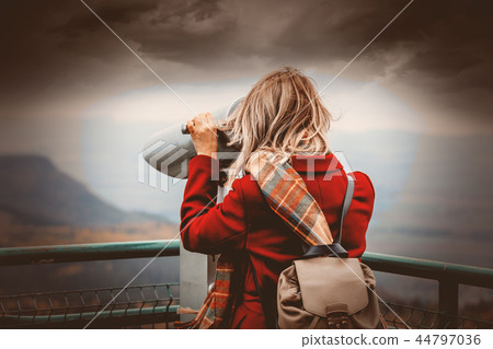 girl with binocular at view place in mountains 44797036