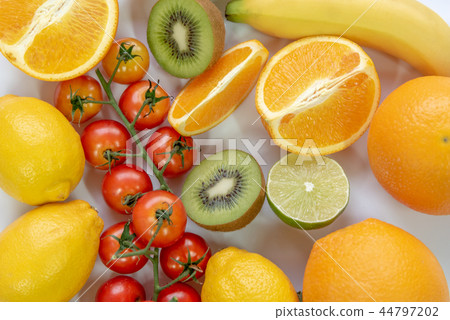 Various sliced fruits on white background Various sliced fruits on white background 44797202