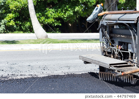 Pavement truck laying fresh asphalt Pavement truck laying fresh asphalt 44797469