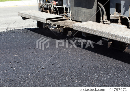 Pavement truck laying fresh asphalt Pavement truck laying fresh asphalt 44797471